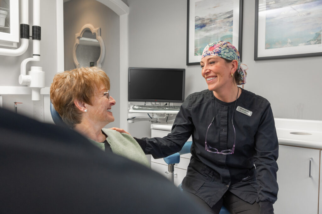 dental hygienist with patient